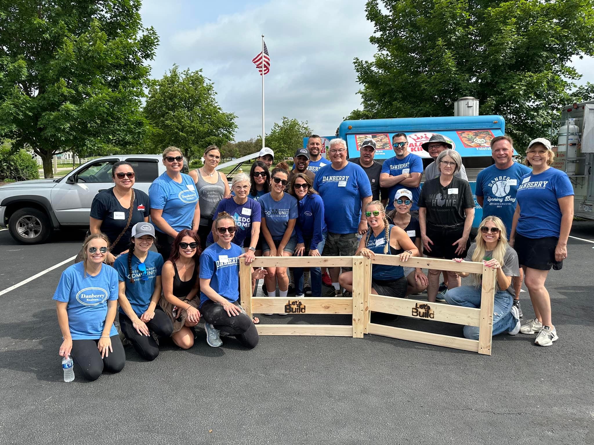 Danberry agents building beds outdoors at Let&rsquo;s Build Beds
